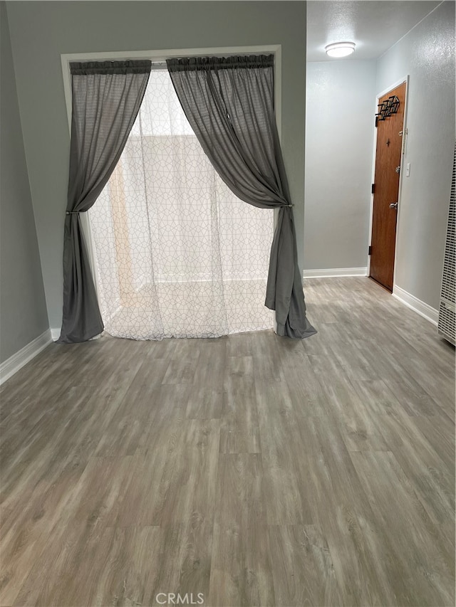 unfurnished room featuring hardwood / wood-style floors