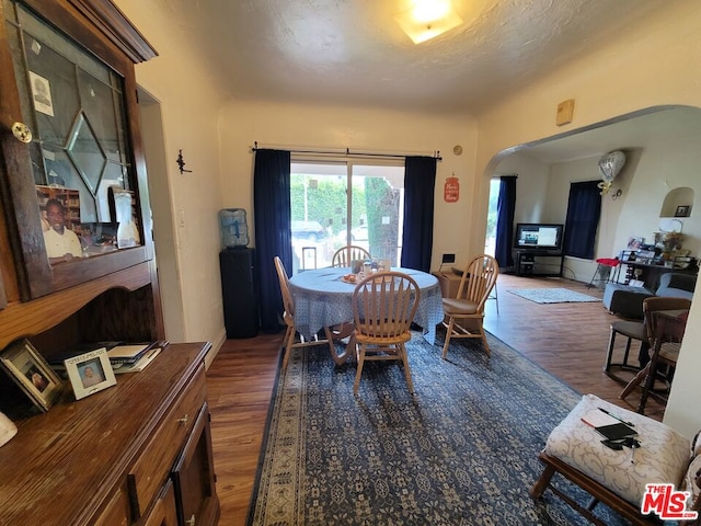 dining room with dark hardwood / wood-style flooring