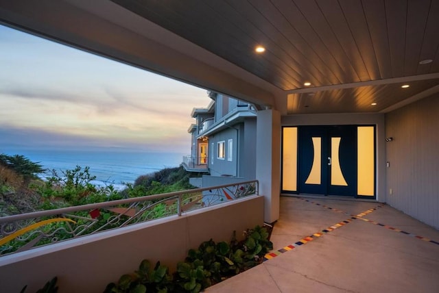 view of balcony at dusk