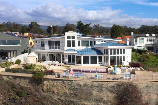 back of house with a patio