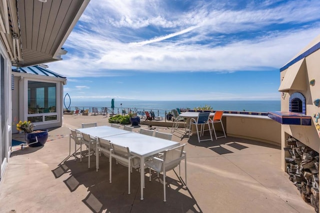 view of patio featuring a water view