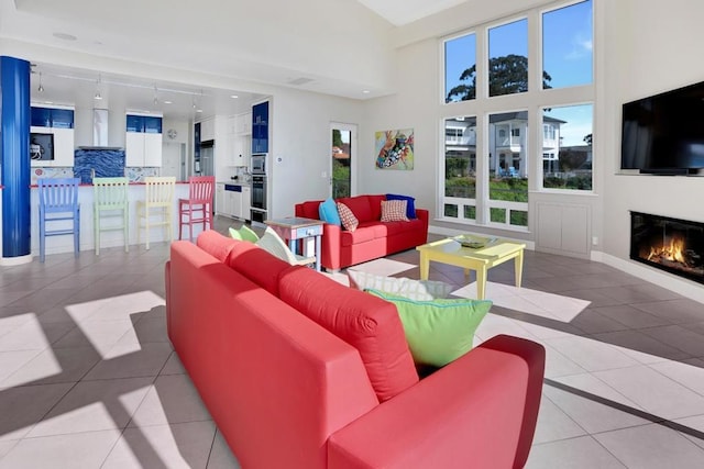 living room with light tile patterned flooring