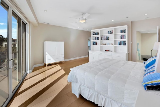 bedroom featuring access to exterior, light hardwood / wood-style flooring, and ceiling fan