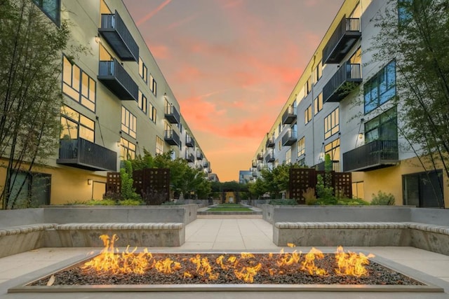 outdoor building at dusk featuring a fire pit