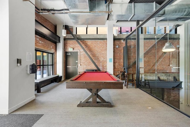 playroom featuring carpet flooring, brick wall, and pool table