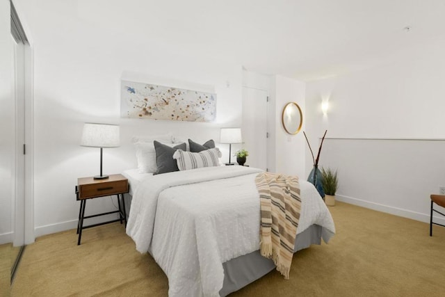 bedroom with light colored carpet