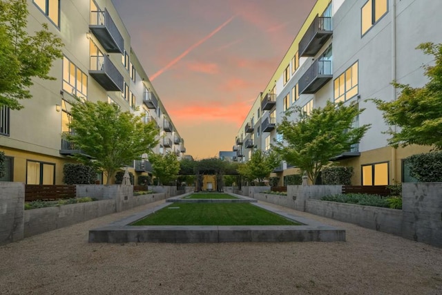 view of home's community with a yard