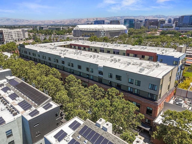 birds eye view of property featuring a mountain view