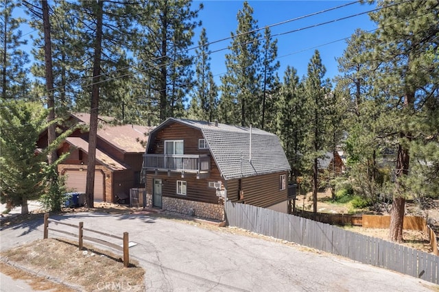 log-style house with a garage