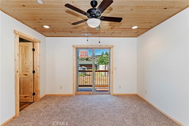 unfurnished room with carpet flooring, ceiling fan, and wood ceiling