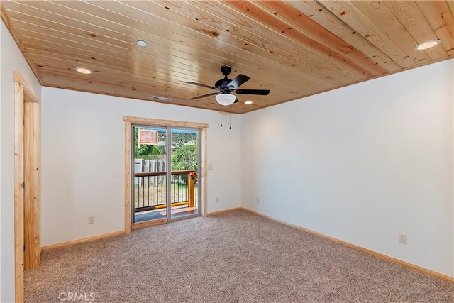 empty room with ceiling fan, carpet, and wooden ceiling