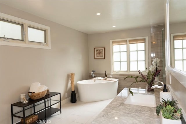 6829 Corintia St, Carlsbad, CA 92009 - bathroom with a soaking tub, vanity, and recessed lighting