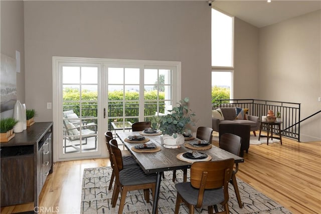 6829 Corintia St, Carlsbad, CA 92009 - dining room with light wood-style floors and a high ceiling