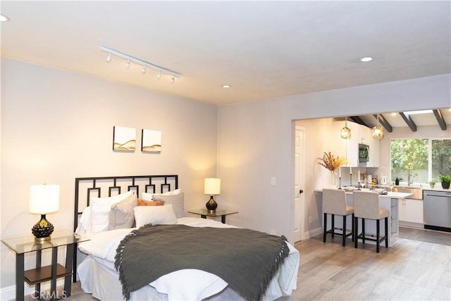 6829 Corintia St, Carlsbad, CA 92009 - bedroom featuring light wood-type flooring, recessed lighting, beam ceiling, track lighting, and baseboards