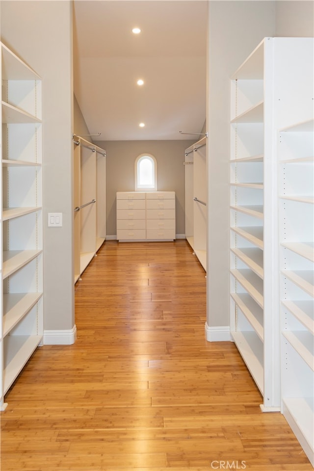 spacious closet with light hardwood / wood-style floors