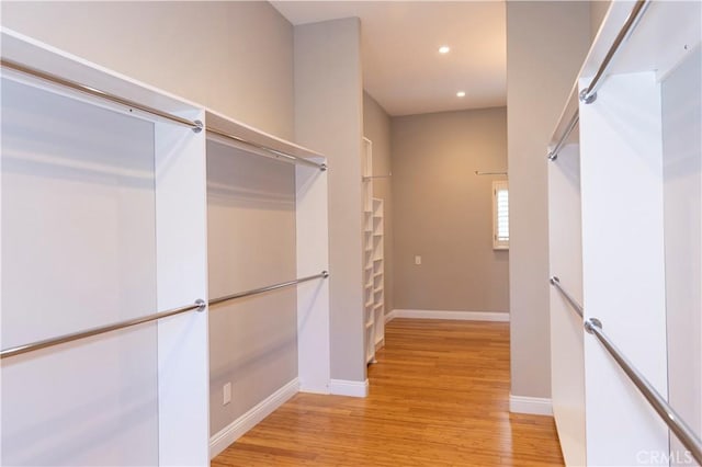 6829 Corintia St, Carlsbad, CA 92009 - spacious closet featuring light wood-style flooring