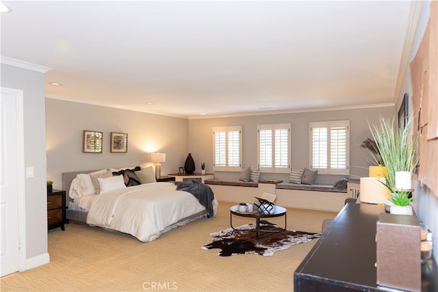 bedroom with light colored carpet and crown molding