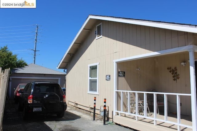 view of home's exterior featuring an outbuilding and a garage