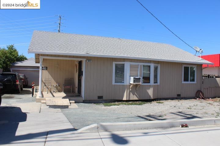 rear view of property featuring cooling unit