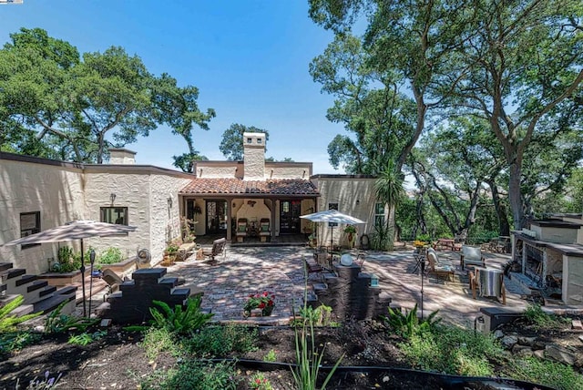 rear view of house featuring a patio area