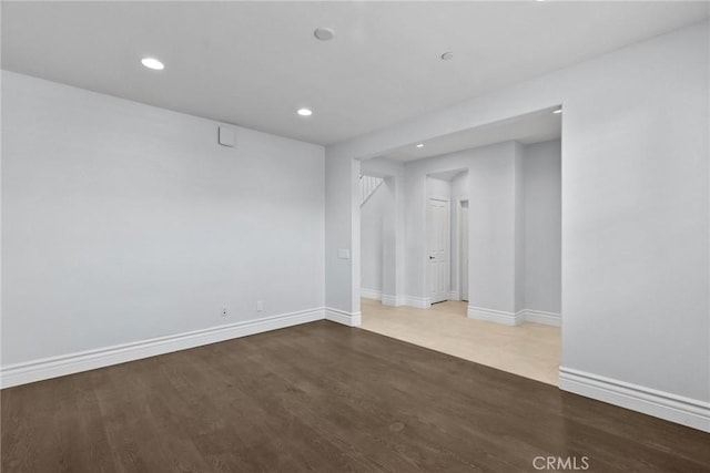 unfurnished room with hardwood / wood-style floors