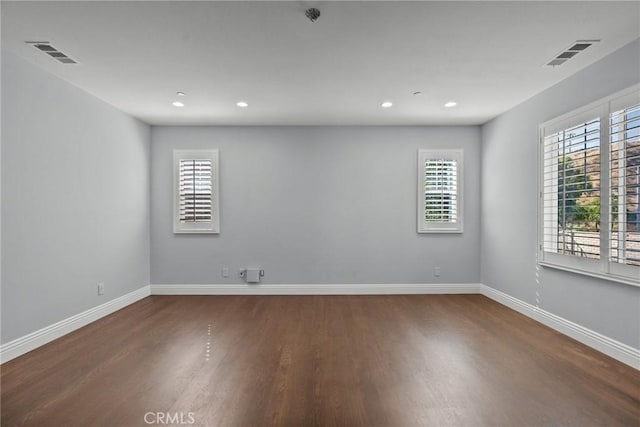 empty room featuring dark hardwood / wood-style floors