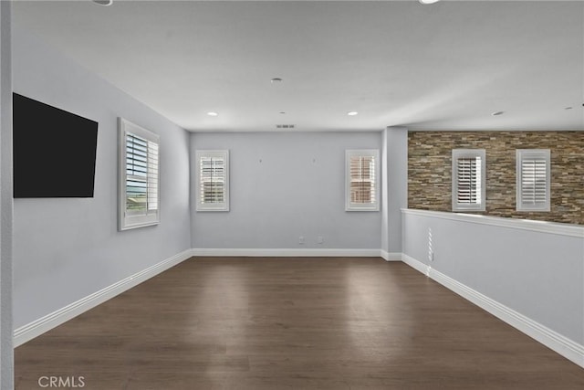 unfurnished room featuring dark hardwood / wood-style floors