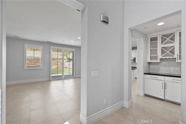 interior space with light tile patterned floors