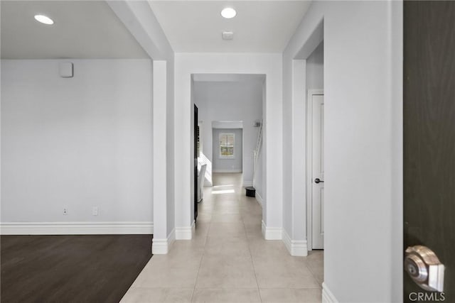 corridor with light hardwood / wood-style flooring