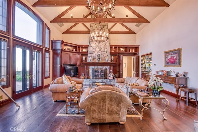 living room featuring beam ceiling, dark wood-type flooring, high vaulted ceiling, an inviting chandelier, and a fireplace