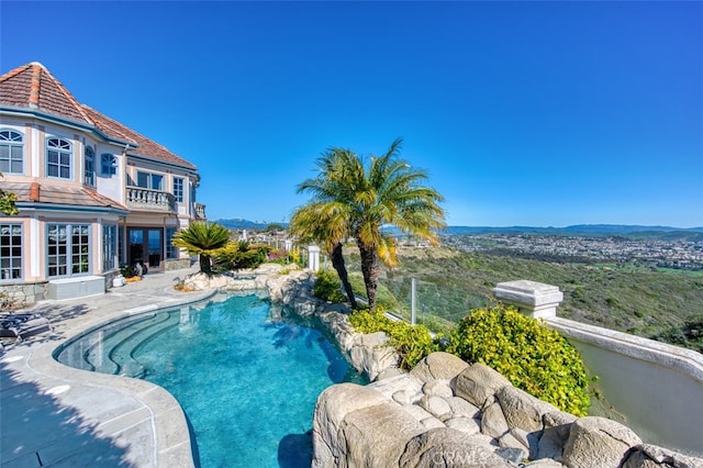 view of swimming pool with a patio