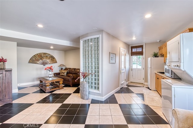 entryway with light tile patterned floors