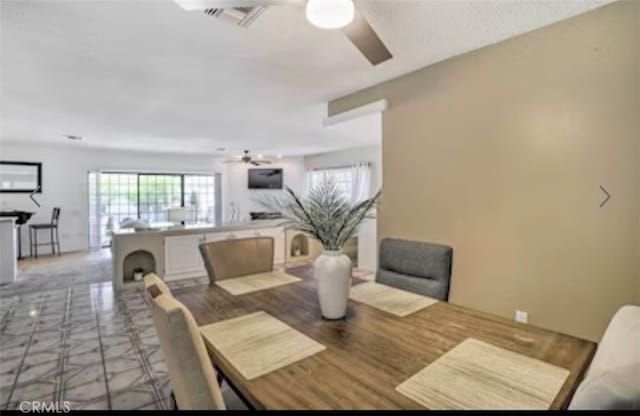 dining area featuring ceiling fan