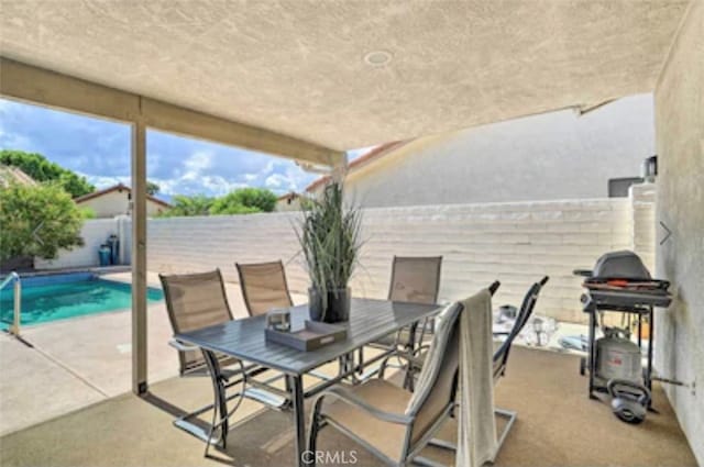 view of patio / terrace featuring a fenced in pool