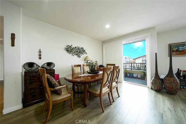 dining space featuring hardwood / wood-style flooring