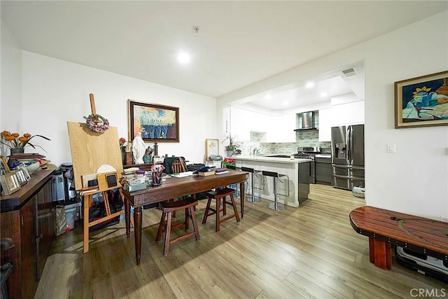 dining area with light wood-type flooring