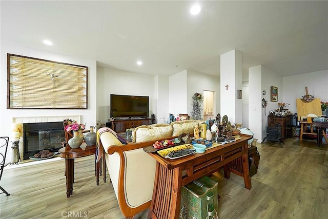 4568 W 1st St Unit 307, Los Angeles, CA 90004 - living area featuring recessed lighting, a glass covered fireplace, and wood finished floors
