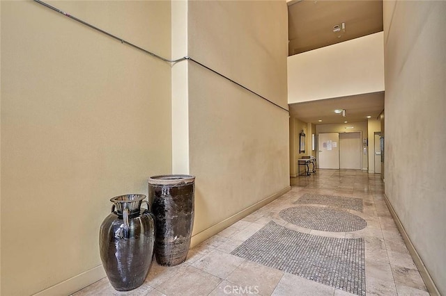 4568 W 1st St Unit 307, Los Angeles, CA 90004 - hall with baseboards and a high ceiling
