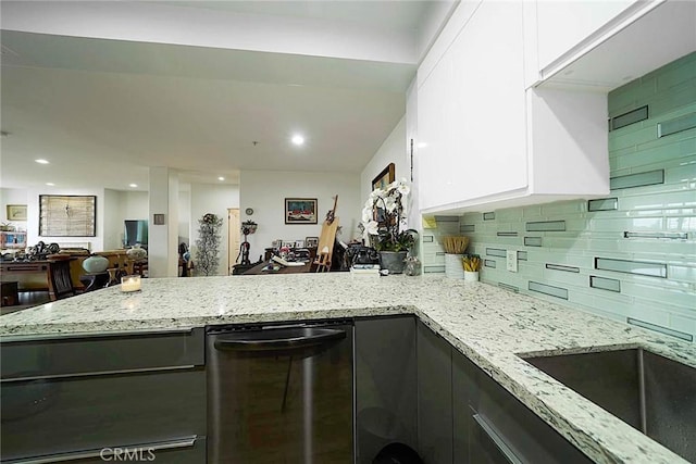 4568 W 1st St Unit 307, Los Angeles, CA 90004 - kitchen with white cabinets, a peninsula, light stone countertops, and dishwashing machine