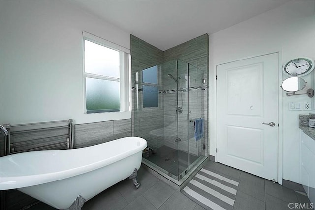 4568 W 1st St Unit 307, Los Angeles, CA 90004 - bathroom with a freestanding tub, a shower stall, and tile patterned floors