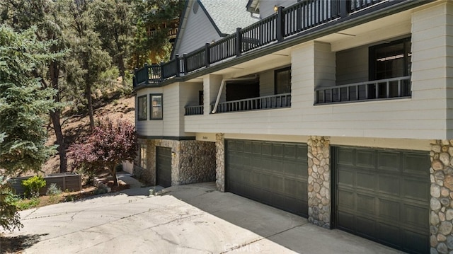 view of property with central AC unit and a garage