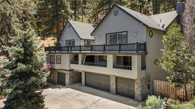 view of front facade with a balcony and a garage