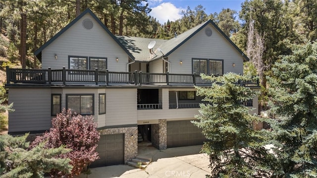 exterior space with a balcony and a garage