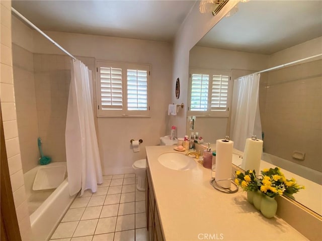 full bathroom featuring tile patterned floors, shower / bath combination with curtain, toilet, and vanity