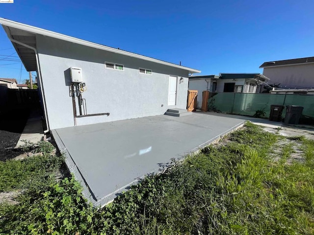 view of storm shelter featuring a patio area