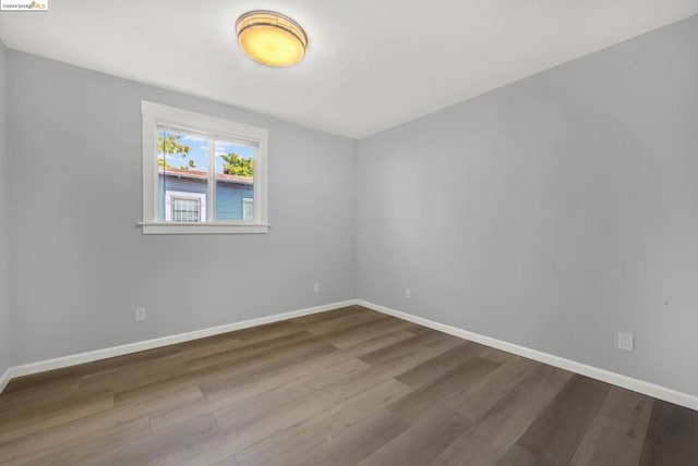 unfurnished room featuring wood-type flooring