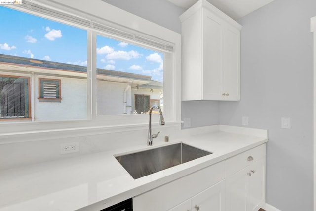 kitchen with sink and white cabinets