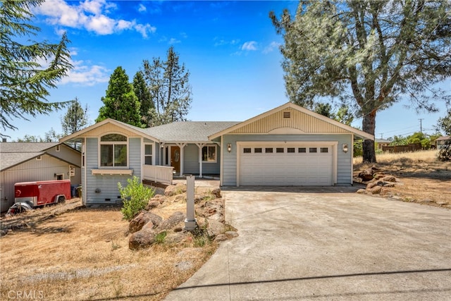 single story home featuring covered porch and a garage