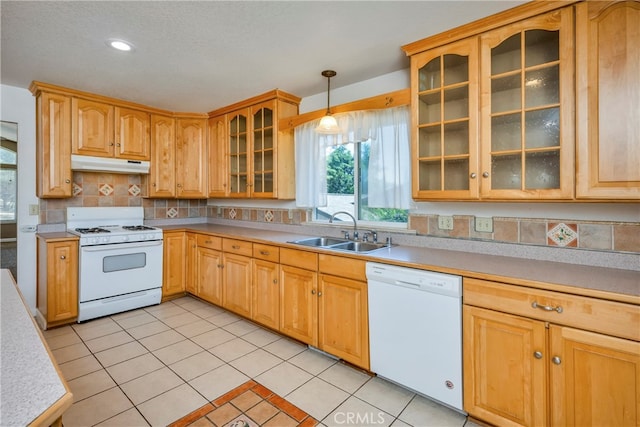 kitchen with pendant lighting, light tile patterned flooring, sink, white appliances, and backsplash