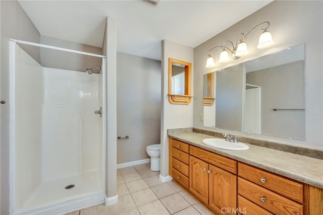 bathroom with tile patterned flooring, a shower, vanity, and toilet